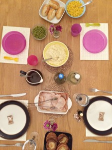 A table set for Thanksgiving dinner as a family of 4