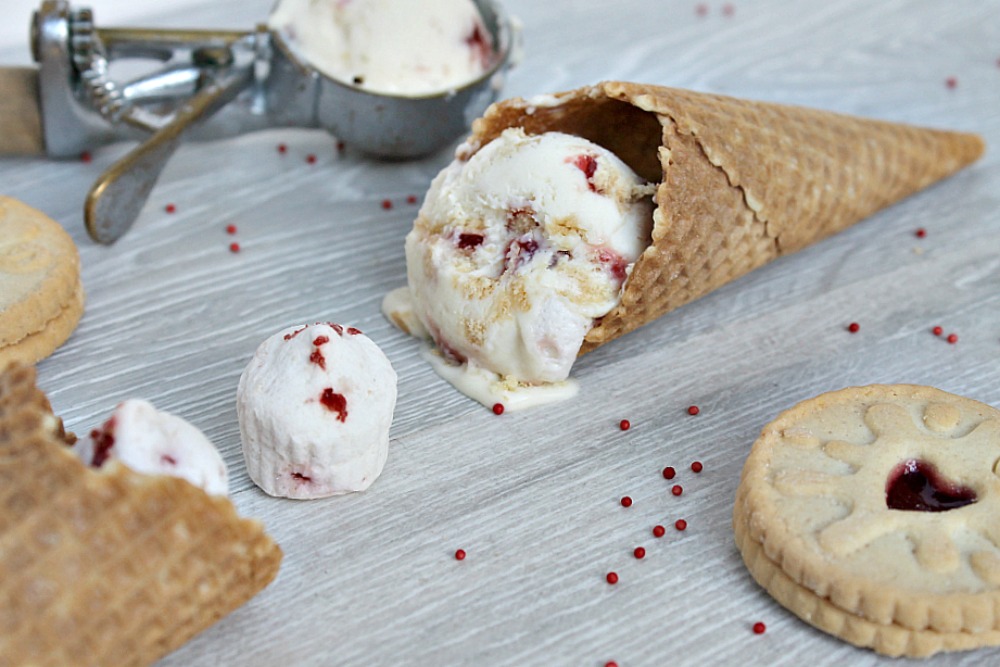 Valentine's Day Jammy Dodger Marshmallow Ice Cream melting out of a cone on to a table