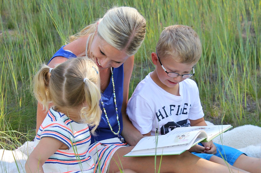 family chill out time reading in the fields together summer travels