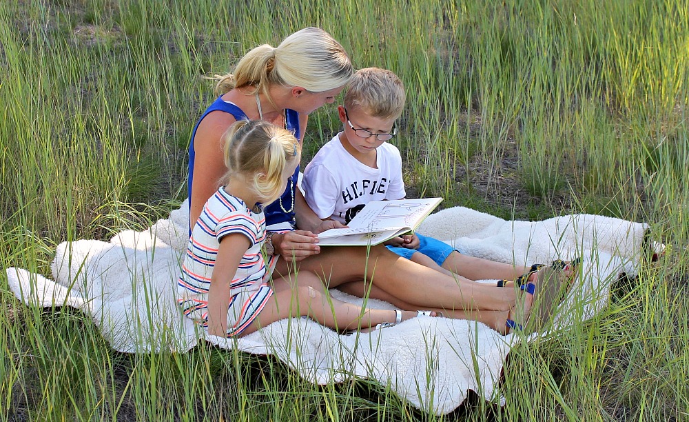 family chill out time reading in the fields together summer travels