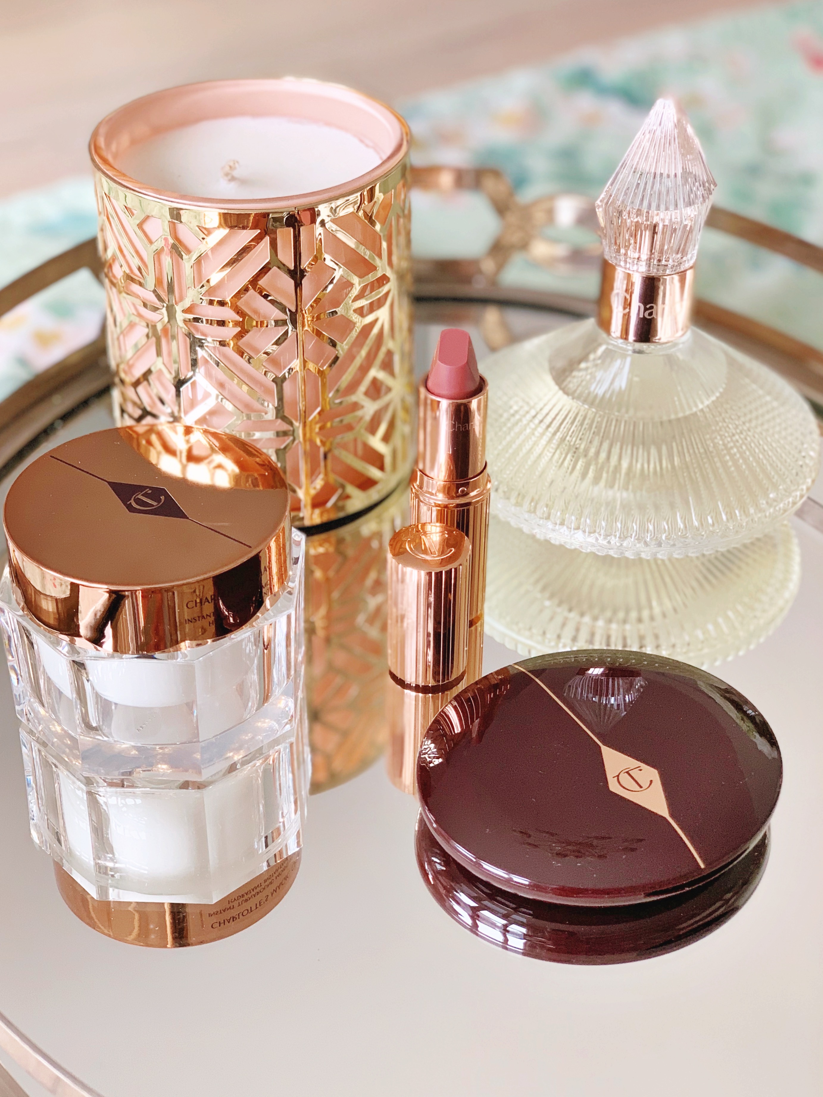 Charlotte Tilbury perfume skincare makeup cream lipstick and blush powder