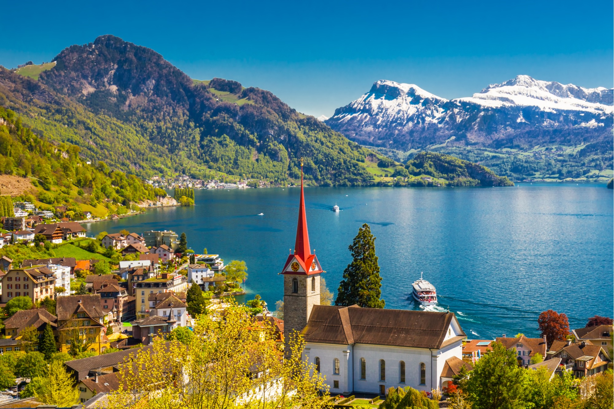 lake lucerne, switzerland. A lake in a beautiful setting with snow capped mountains in the background