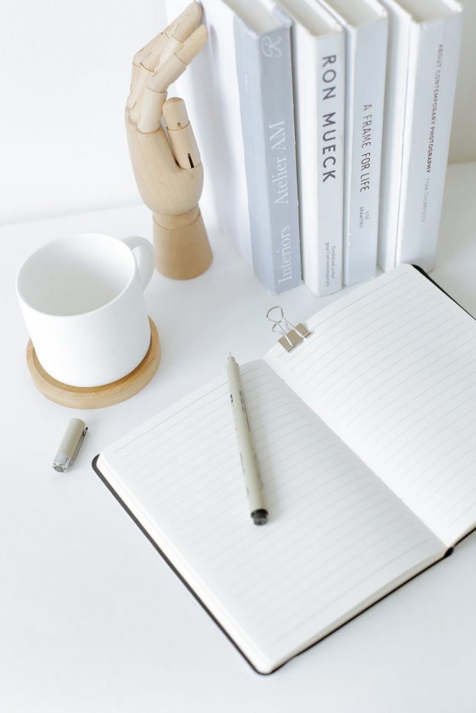 feng shui in your home notebook opened on desk near books