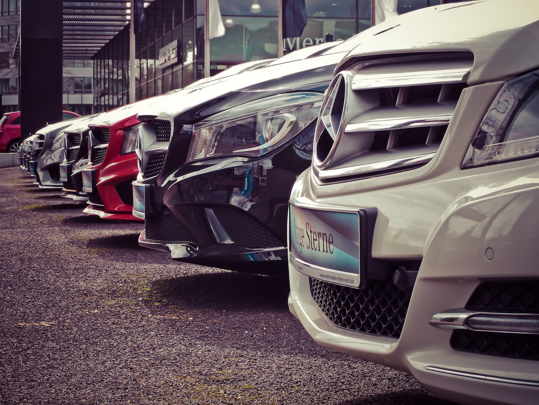 mercedes benz cars parked in a row