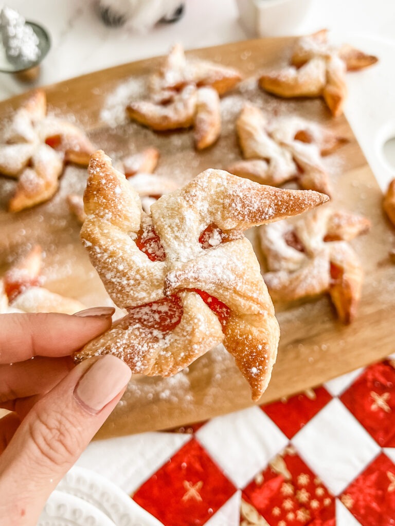 Christmas Jam Star Puff Pastry being held 