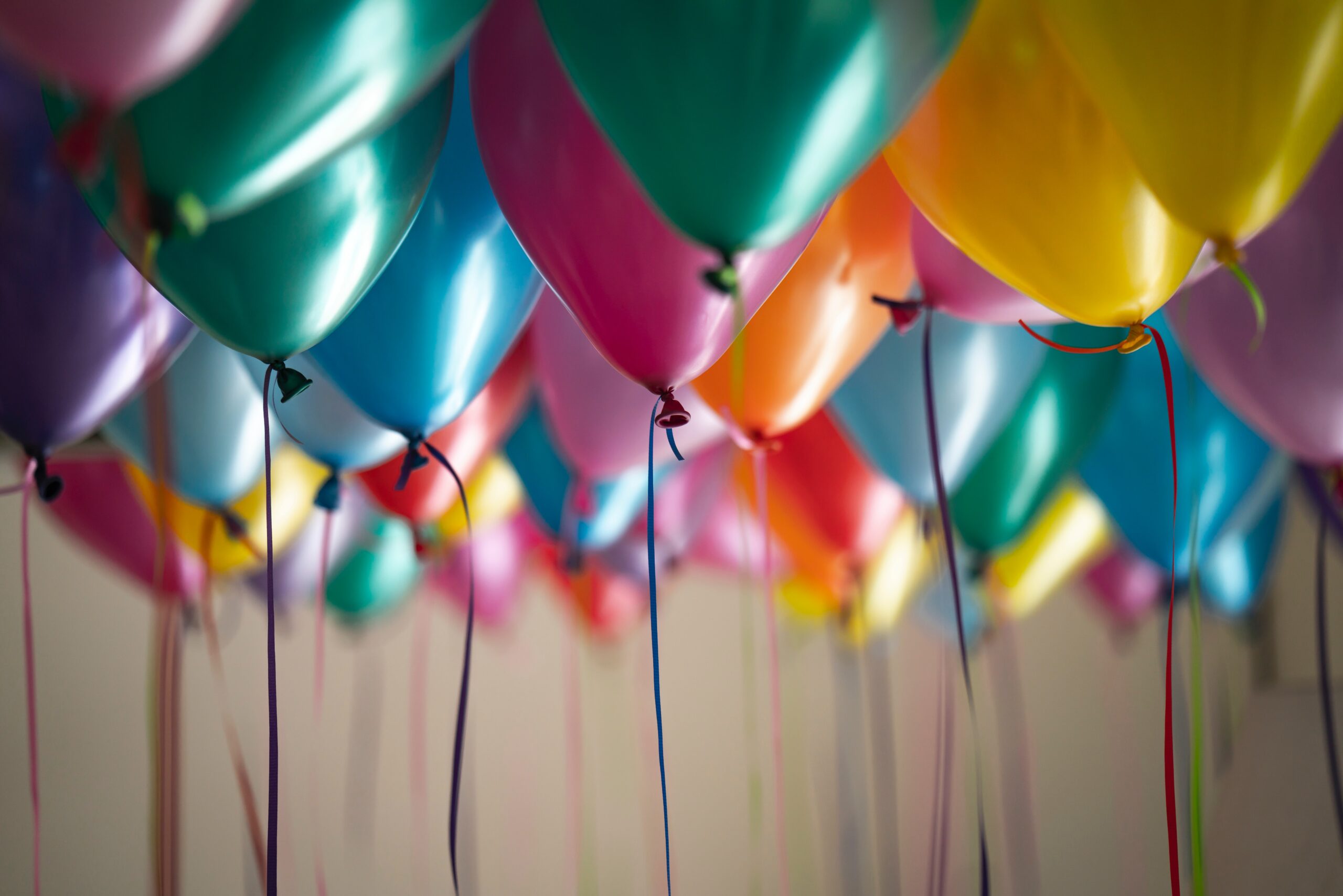 An artistic display of balloons floating in the air.