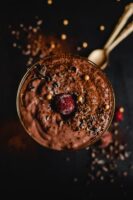 Indulge in a decadent Valentine's Day treat - chocolate mousse with cherries and chocolate chips.